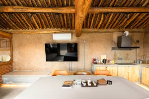 Clean, minimalist interior design featuring concrete and wood materials.