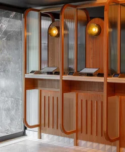 Modern restaurant interior featuring transparent glass walls and wooden fixtures.
