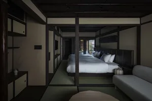 Modern bedroom featuring hardwood floors and tatami mats