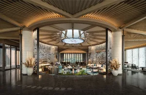 A modern hotel lobby featuring glass and concrete materials