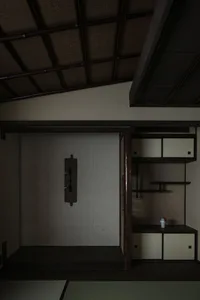 A modern interior with a wooden closet featuring a traditional Japanese design.