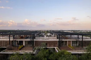 Modern residential architecture featuring detailed bamboo and concrete structural elements