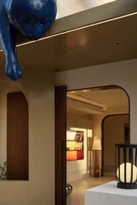 Modern living room with wooden floor, archways, and decorative lighting.