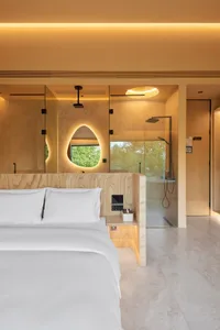 Minimalist bedroom with a bed, marble floor, and wooden accents.