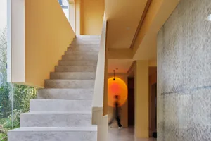 A modern staircase made of concrete materials, featuring clean lines and a minimalist design.
