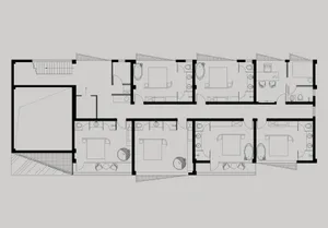 A modern residential floor plan depicting a house with four bedrooms, bathrooms, and a kitchen.