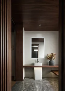 Modern bathroom featuring marble and wood elements