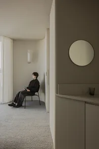 Minimalist living room with concrete and glass materials