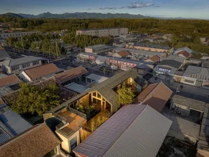 Aerial view of a community center with various mixed materials and architectural features.