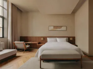 Modern minimalist bedroom with wooden furniture, white bedding, and a large window