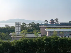 A modern residential building featuring glass exteriors
