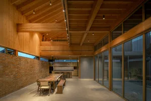 A modern residential kitchen featuring natural wood materials.