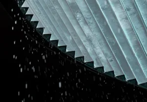Metal roof panels during a rainfall.