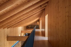 Modern interior design featuring wooden walls and floors.