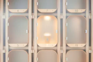 Minimalist hotel lobby featuring glass lighting fixtures