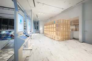 Modern, elegant coffee shop interior with glass walls and counters.