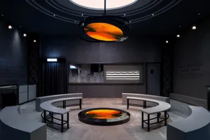 A modern exhibition room with metallic finishes.