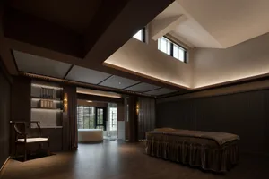 A modern bedroom featuring walnut furniture, fabric bedding, and glass windows.