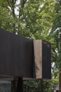 Black metal architectural facade with perforated metal panel