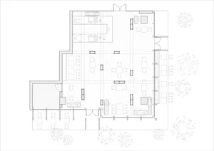 Floor plan of an office space with desks arranged in rows.