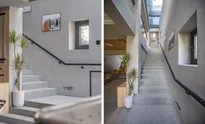 Modern industrial-style stairwell with concrete steps and minimalist design.