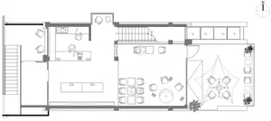 Floor plan of a modern restaurant featuring concrete, glass, and metal materials.