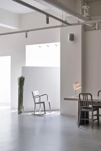 Modern minimalist office interior with concrete flooring and minimalist furniture.