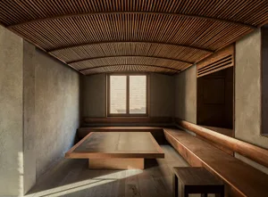 A minimalist interior space featuring wooden elements.