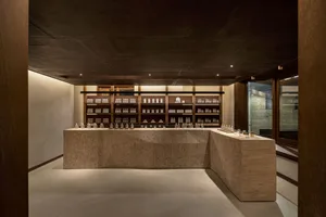 A modern retail storefront featuring a concrete interior design.