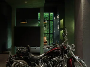 A motorcycle parked in an industrial-style interior room.