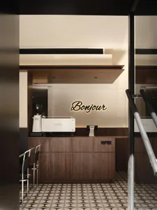Modern cafe interior with wooden walls and a bar counter