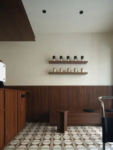 Modern coffee shop interior with wooden elements and white tiles
