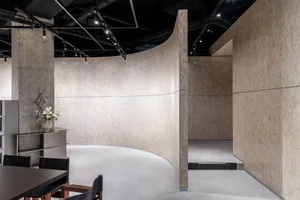 Modern office space featuring concrete and metal materials.