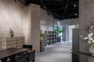 Modern showroom featuring concrete, steel, and glass materials