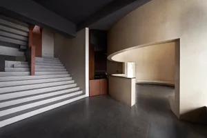Interior design featuring modern industrial elements with concrete materials.