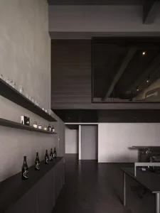 Modern industrial office space with concrete walls and metal accents.