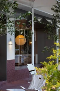 Modern interior design featuring a glass door with views of the garden.
