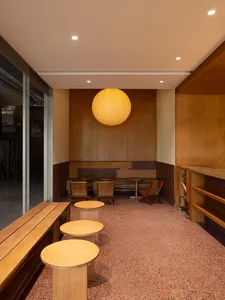 Cafe interior with wooden furniture and terrazzo flooring