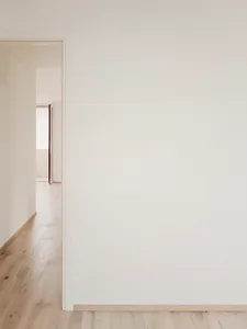 A minimalist wall interior with neutral colors and clean lines.