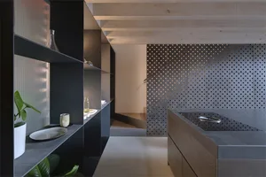 Modern living space with metallic accents and geometric design elements.