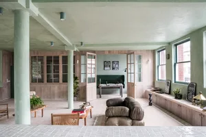 A modern living room featuring wooden furniture and decor.