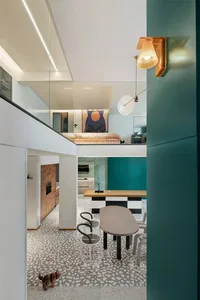 Modern living room with a loft bed and a terrazzo floor.
