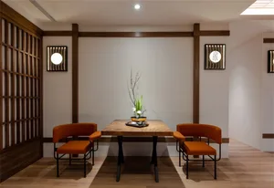 A modern wooden restaurant console with metal accents and seating.