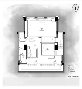 A detailed 2D architectural drawing of a residential floor plan on paper showing rooms and layouts of a house.