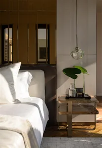 Modern bedroom with glass lampshade and marble accents