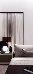 A minimalist bedroom with a glass partition and fabric elements.