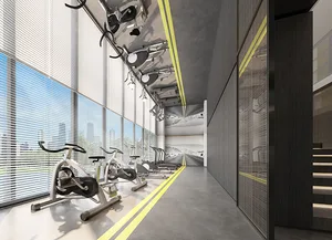 A minimalist fitness center with concrete flooring and metal fitness equipment.
