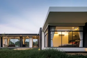 Modern bedroom with concrete and glass materials