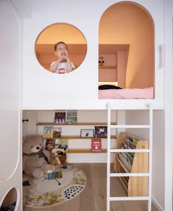 A modern children's room with a wooden play area, books, and a ladder.