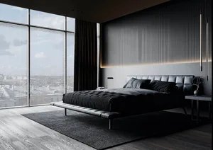 A minimalist bedroom featuring a modern leather platform bed with gray upholstery against a gray wall with a large window.